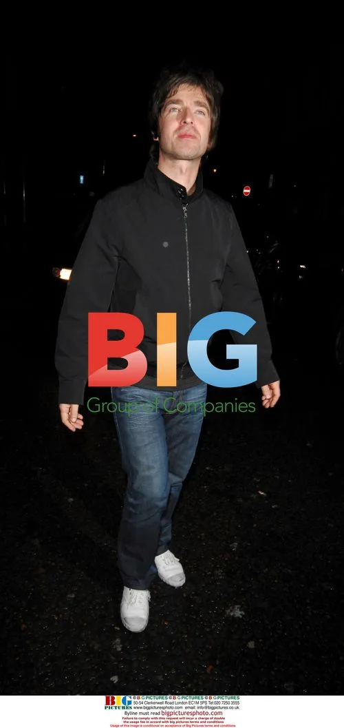 Noel Gallagher and Sarah MacDonald leaving Groucho Club