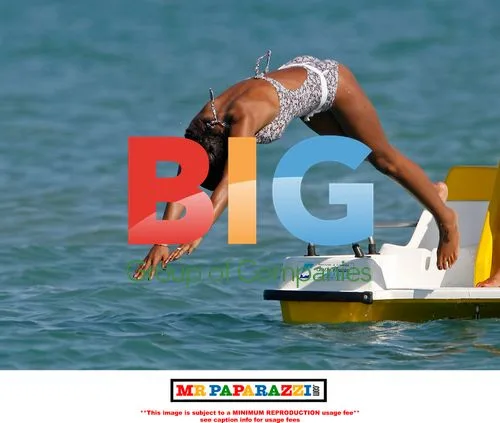 Charley Uchea Enjoys Pedalo Slide in Spain