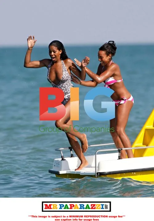 Charley Uchea Slides into the Sea with Sister