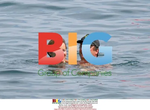 French Politician Hollande Swims with New Companion