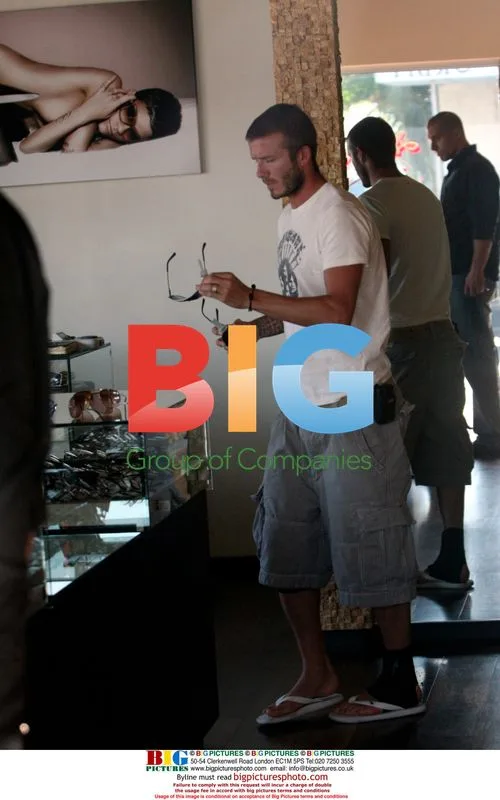 David Beckham shops for sunglasses with son Brooklyn