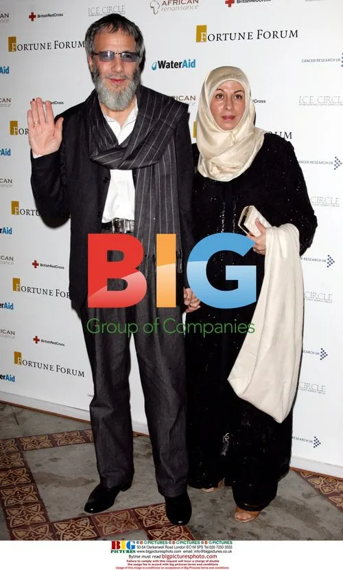 Yusuf Islam and partner arrive at Fortune Forum