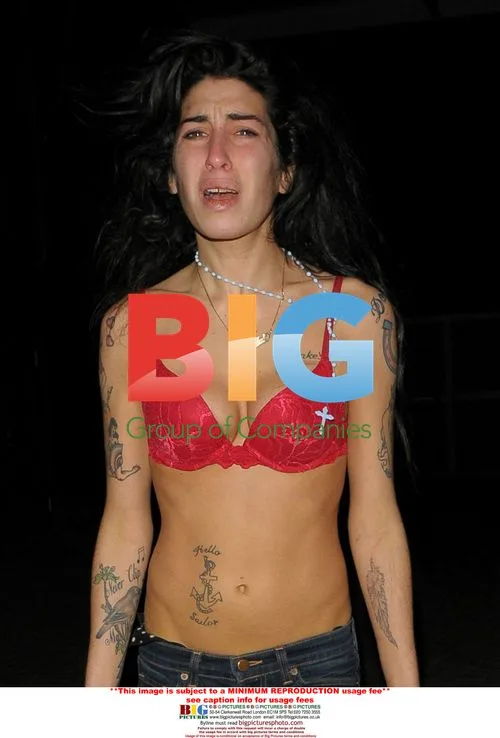 Amy Winehouse Barefoot and Distressed