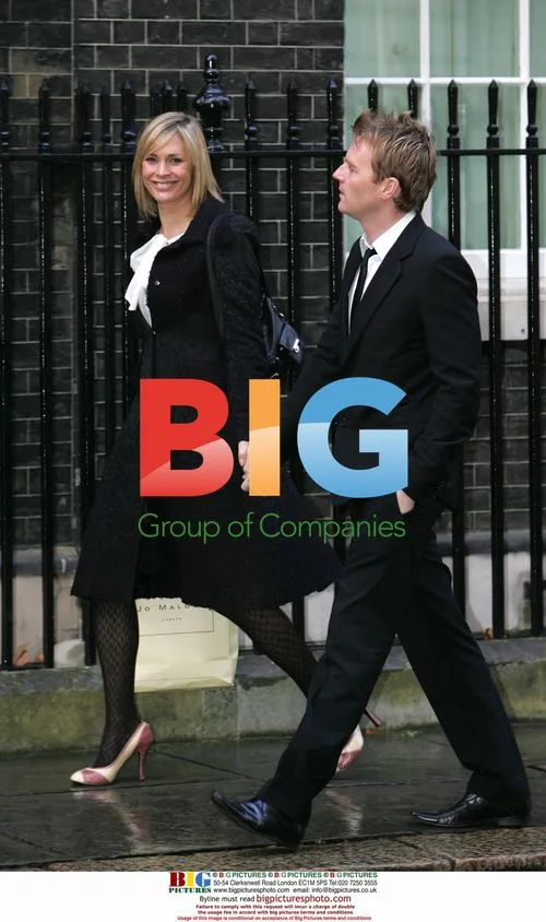 Jenni Falconer and guest at Downing Street Christmas party
