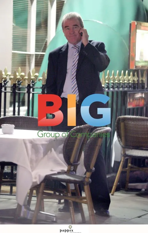 Terry Venables chatting on phone in London