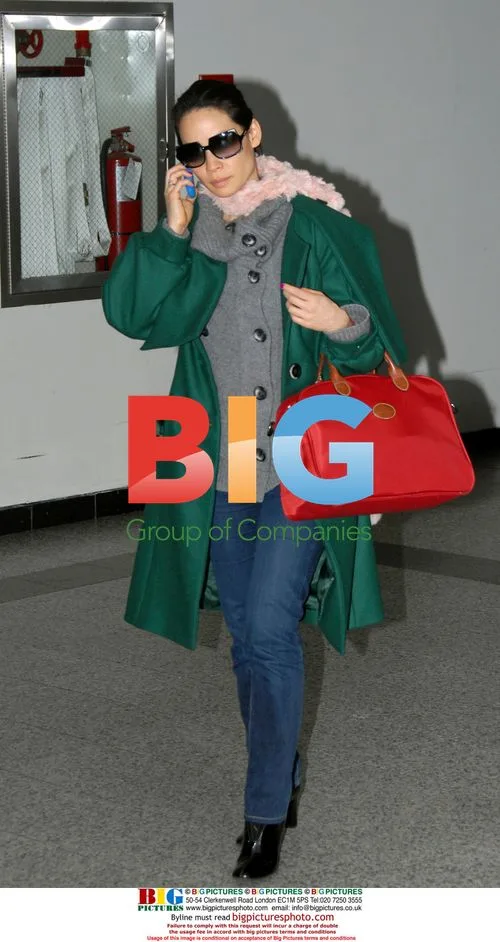 Lucy Liu Arrives at La Guardia With Bodyguard