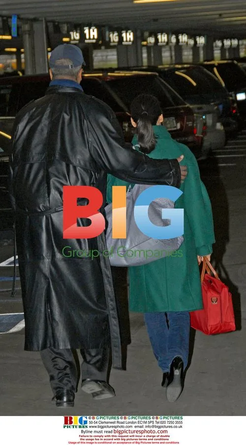 Lucy Liu arrives at La Guardia with bodyguard