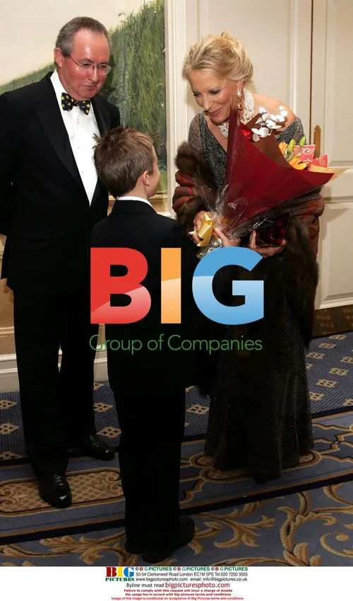 Steven Tomlinson Presents Flowers to Princess Michael