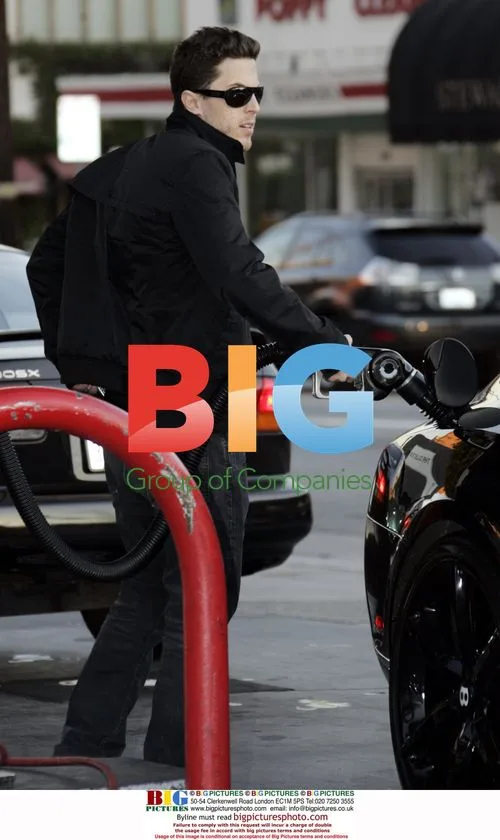 Harry Morton pumping gas