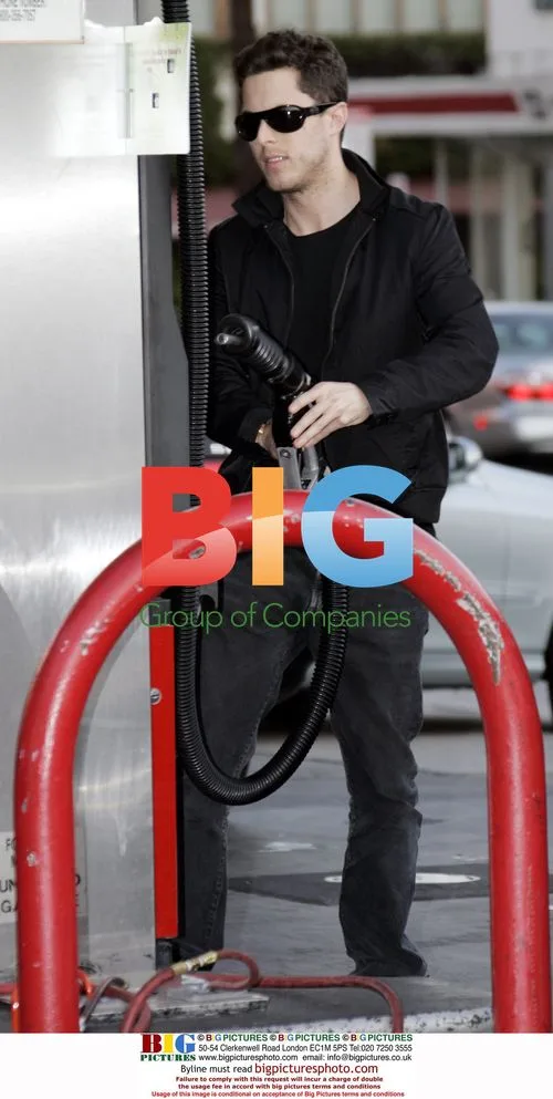 Harry Morton pumping gas