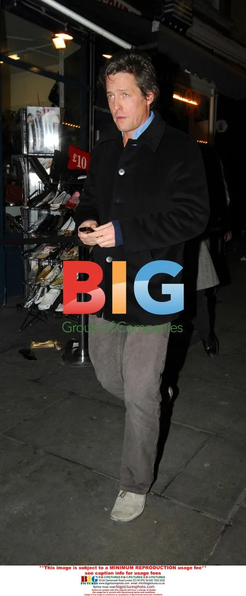 Hugh Grant Leaves Restaurant with Friends