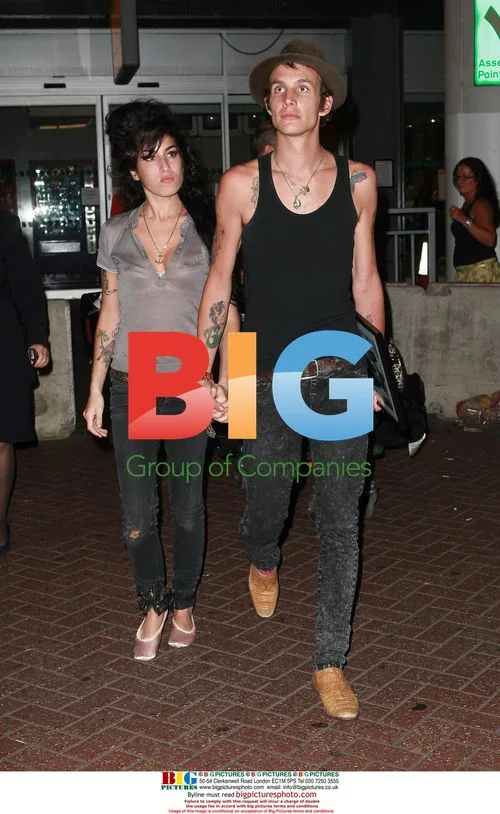 Amy Winehouse and Blake Fielder-Civil Arrive at Gatwick