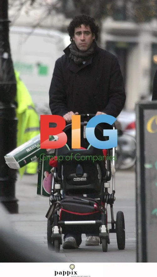 Stephen Mangan and wife with baby in London
