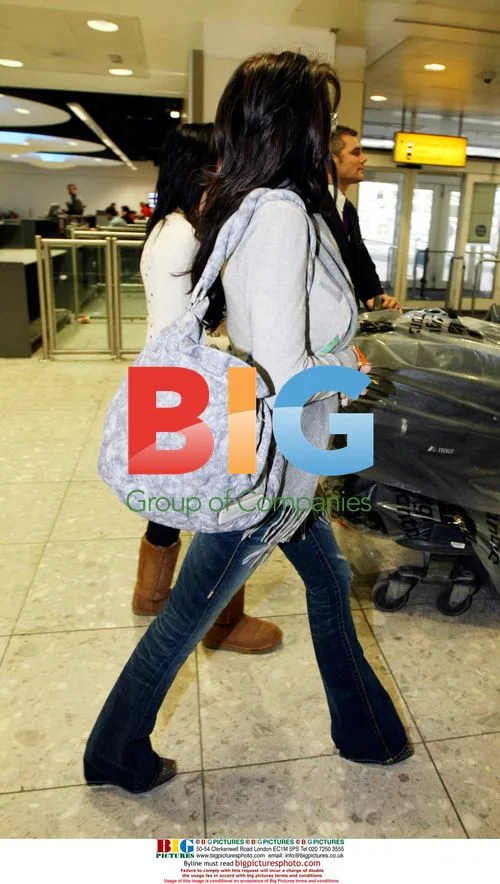 Katie Price arrives at London airport
