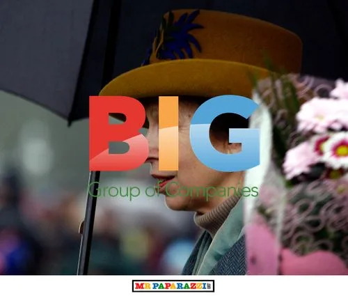 The Queen braves rain at Sandringham