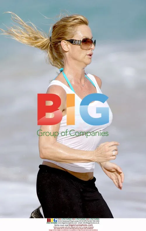 Nicollette Sheridan jogs on beach