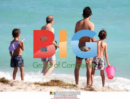 Raul Gonzales Blanco with sons at Ritz-Carlton beach