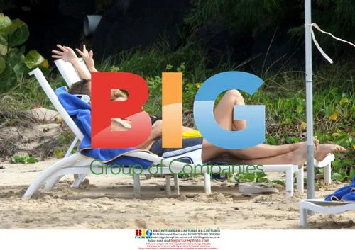 Nicolette Sheridan Applies Sunscreen While on Holiday