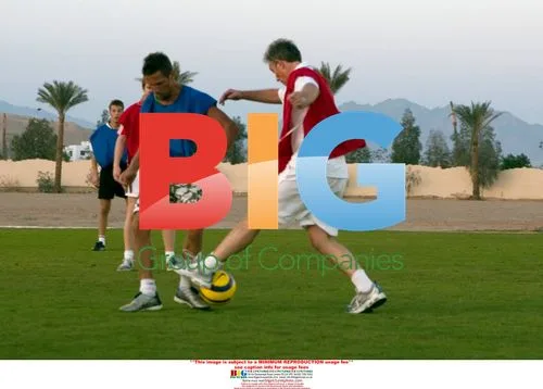 Tony Blair and son play football on vacation