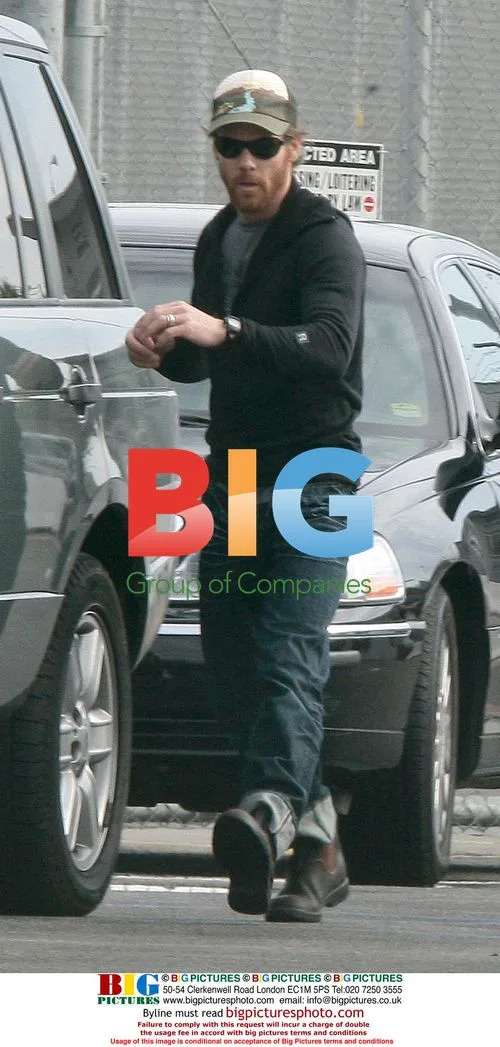Pregnant Julia Roberts Kisses Husband at Private Jet