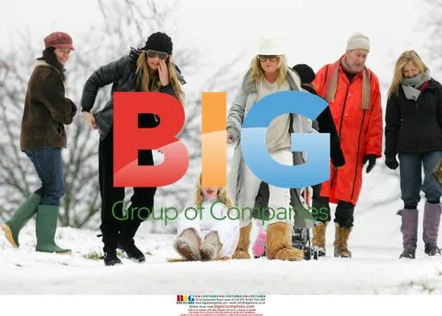 Meg Matthews and Anais sledging in snow