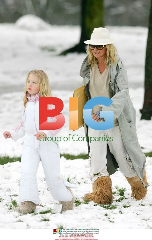 Meg Matthews and daughter Anais sledging in London