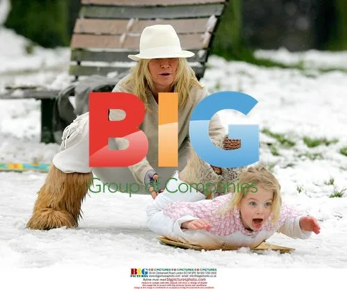 Meg Matthews and Daughter Sledging