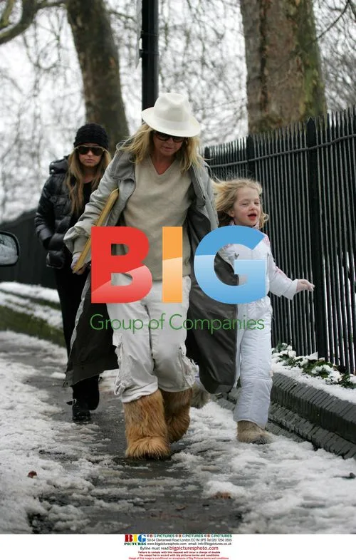 Meg Matthews and Daughter Sledding