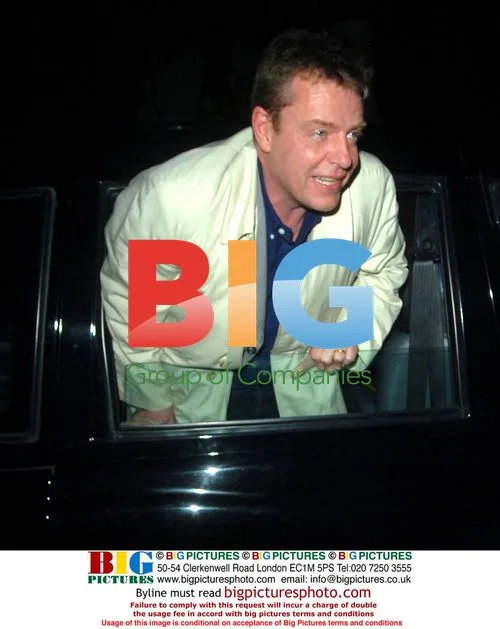 Suggs narrowly avoids bus at Brit Awards party