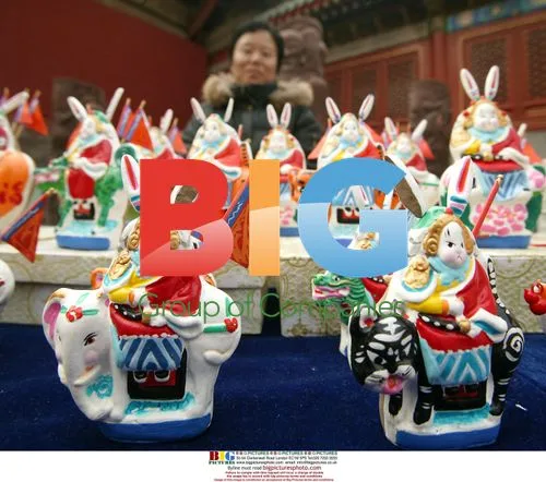 Chinese Woman Selling Rabbit Figurines
