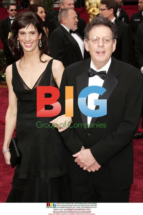 PHILIP GLASS and Guest at 79th Oscars