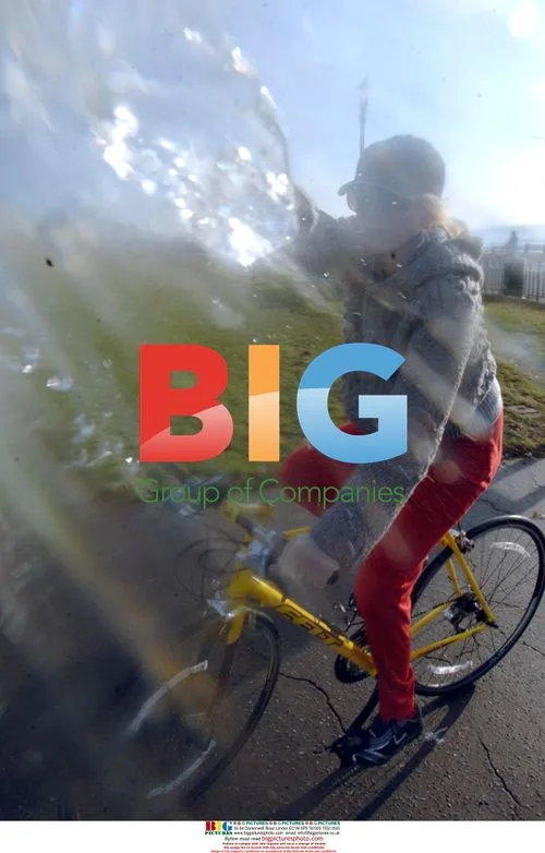 Heather Mills Rides Bike on Seafront