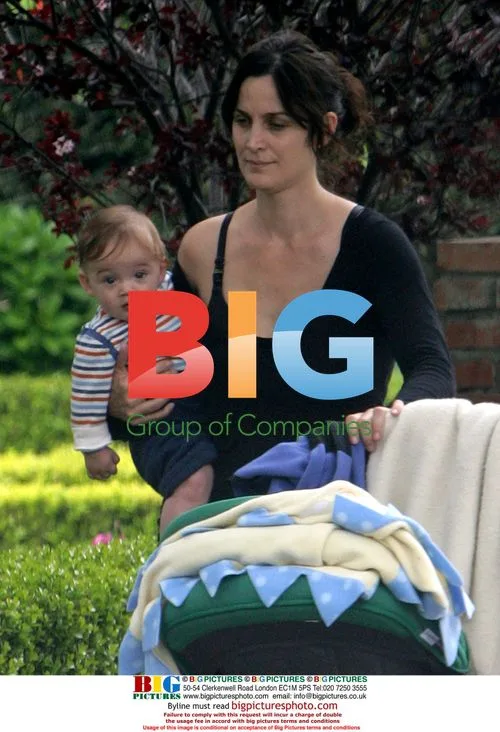 Carrie-Anne Moss takes newborn son for stroll