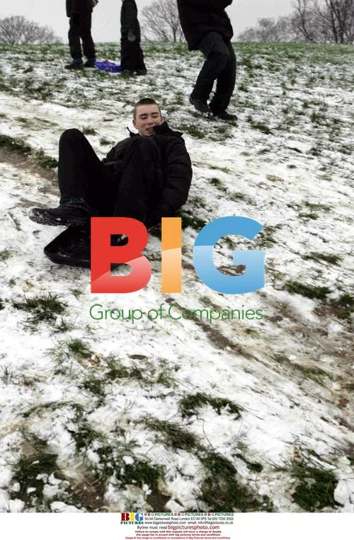 Public Having Fun in London Snow