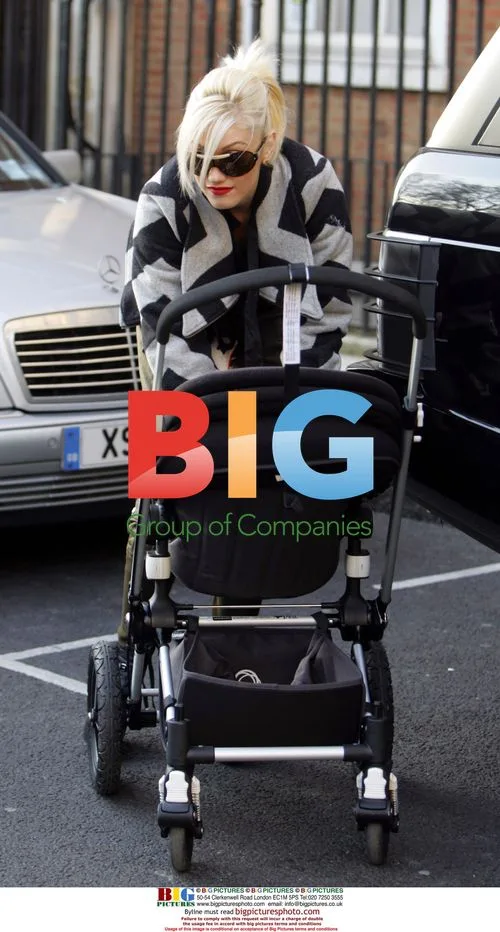 Gwen Stefani Helps Husband Gavin With Pushchair