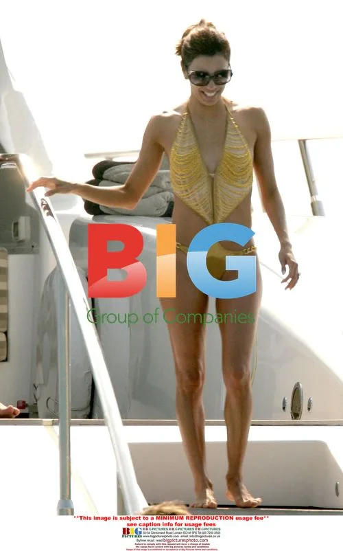 Eva Longoria in Gold Swimsuit with Tony Parker