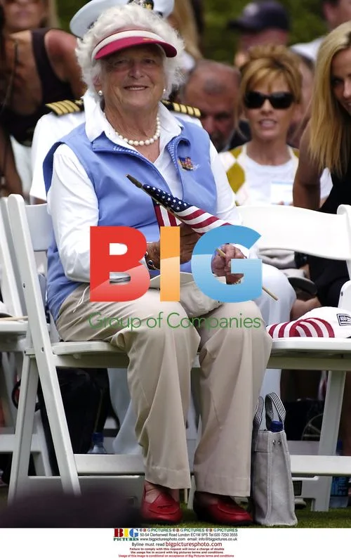 Barbara Bush Holds Flag as Woods Arrives at AT&T National