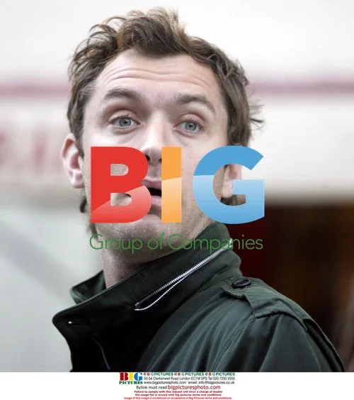 Jude Law chats with friends in London
