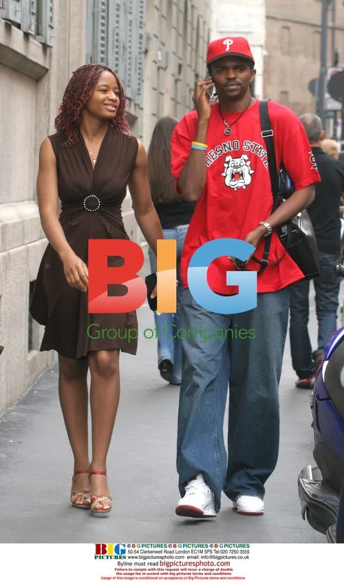 Nigerian Footballer Kanu Shops with Wife in Milan