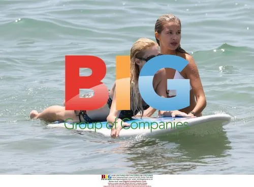 Paris Hilton Learning to Surf in Malibu