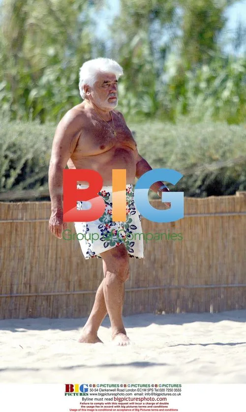 Actor Mario Adorf relaxes on beach in Saint-Tropez