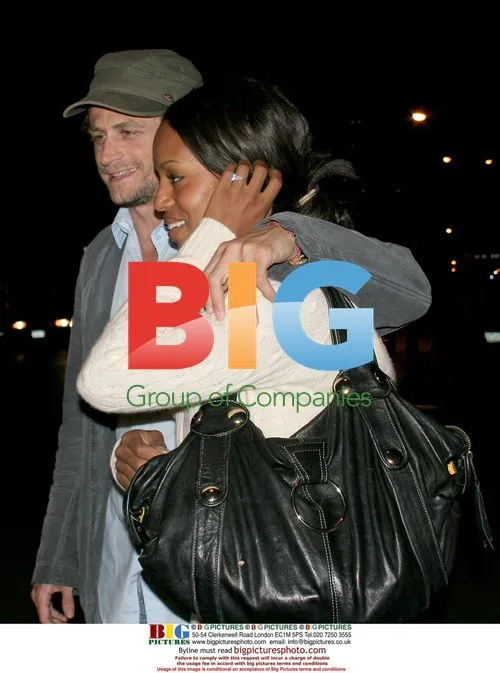 Kerry Washington and David Moscow enter taxi