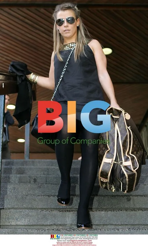 Coleen Mcloughlin with Bags at Euston Station