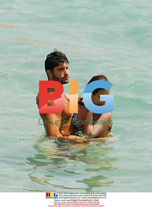 Monica Cruz at the beach with boyfriend and mother