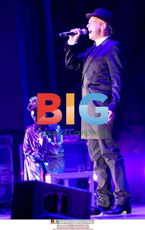 Neil Tennant of Pet Shop Boys performs live