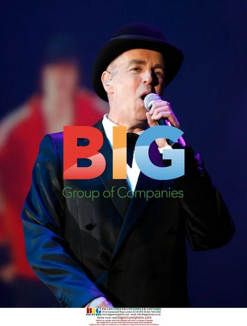 Neil Tennant of Pet Shop Boys performs live