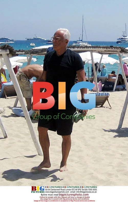 Giorgio Armani Relaxing on Beach in St. Tropez