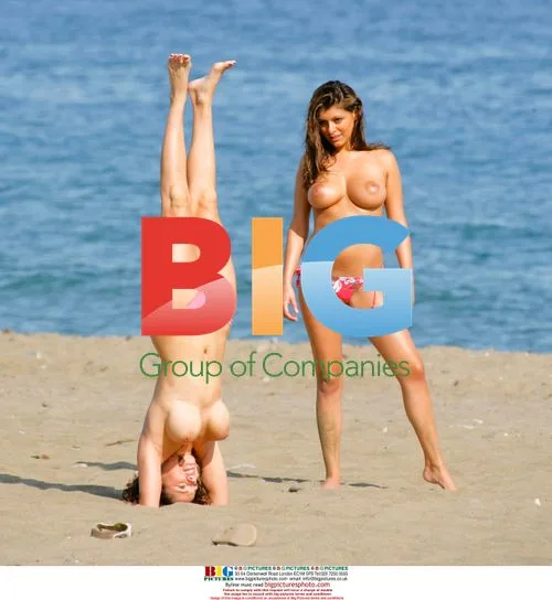Glamour models enjoy Spanish beach