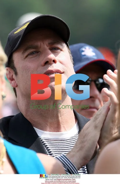 John Travolta claps for Cal Ripken Jr. at Hall of Fame induction