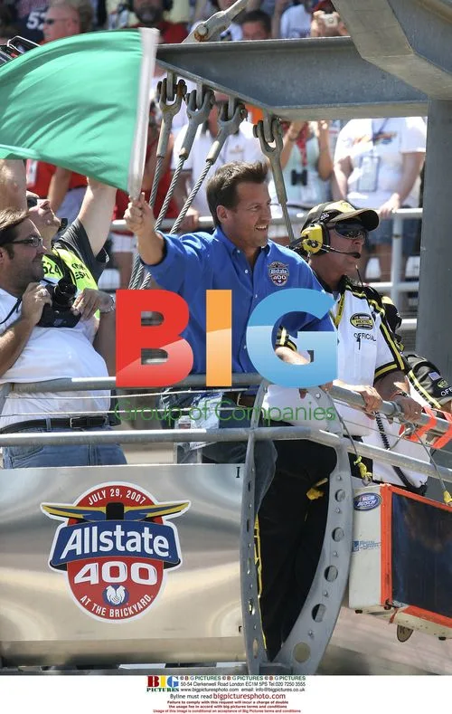 James Denton waves flag at Brickyard 400